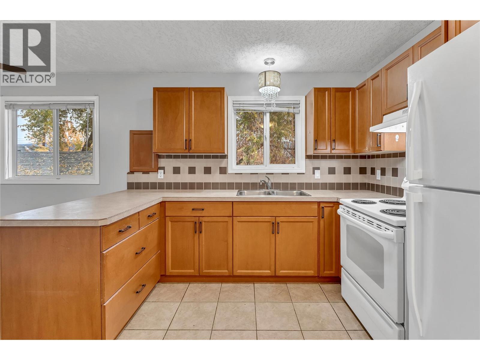654 Wade Avenue W Unit# 101 & 201, Penticton, BC - Indoor Photo Showing Kitchen With Double Sink