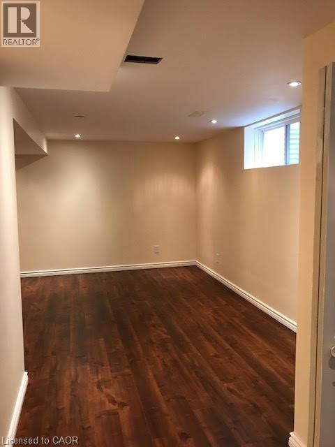 Basement with dark wood-style flooring and recessed lighting - 567 Chablis Drive, Waterloo, ON - Indoor Photo Showing Other Room