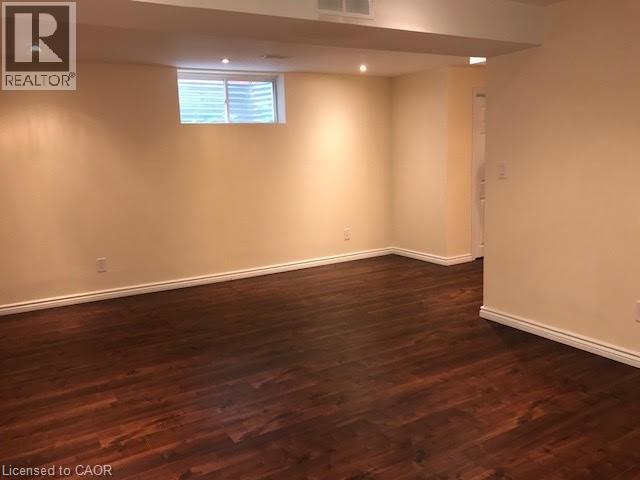 Basement with dark wood-type flooring and recessed lighting - 567 Chablis Drive, Waterloo, ON - Indoor Photo Showing Other Room