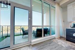 3 W/O from Kitchen, Living Room & Primary Suite -