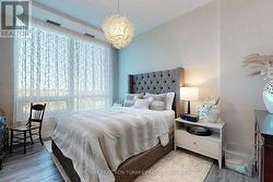 Second Bedroom with floor to ceiling windows -