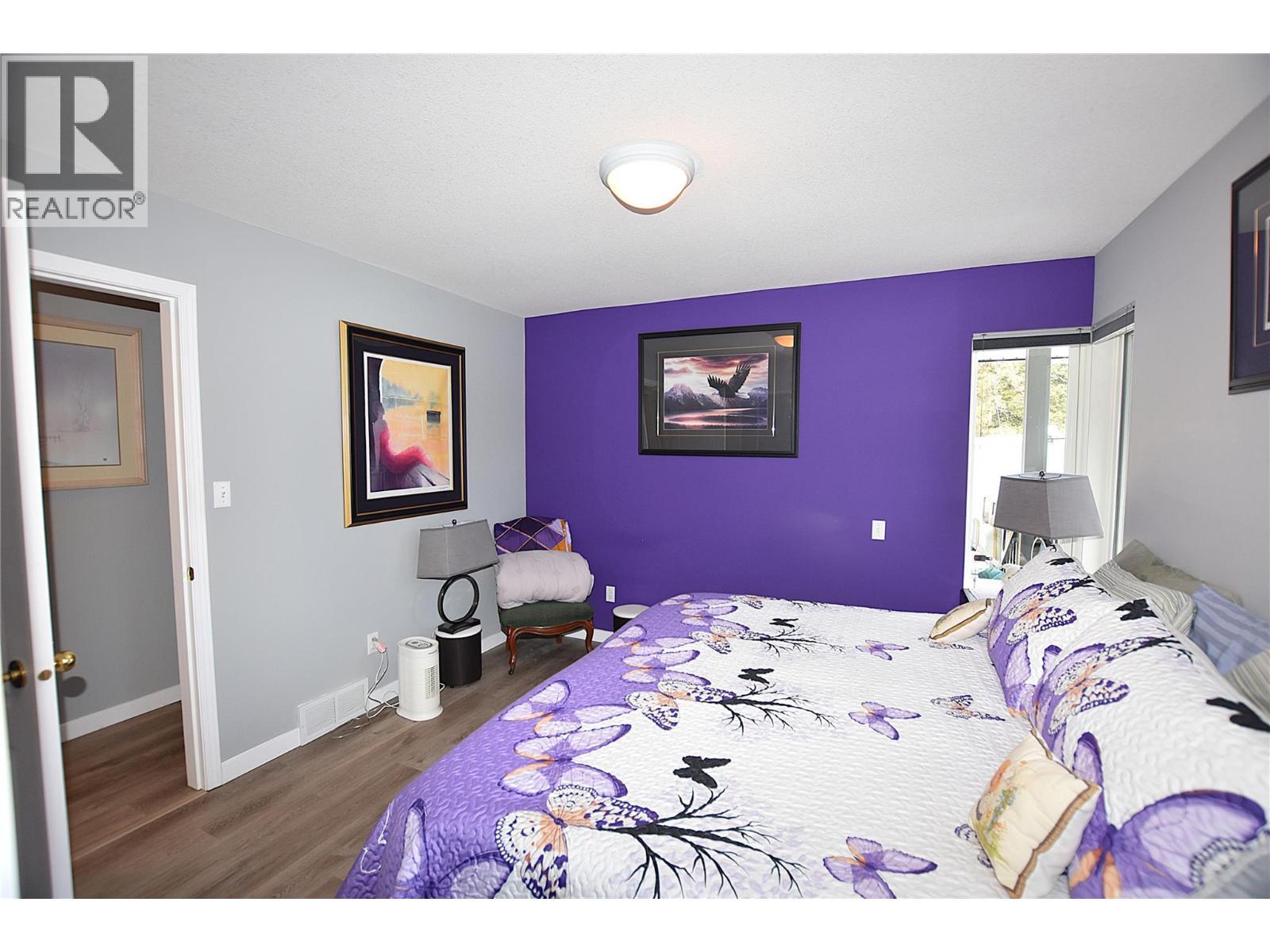 easily fits a king bed - 145 Falcon Avenue, Vernon, BC - Indoor Photo Showing Bedroom