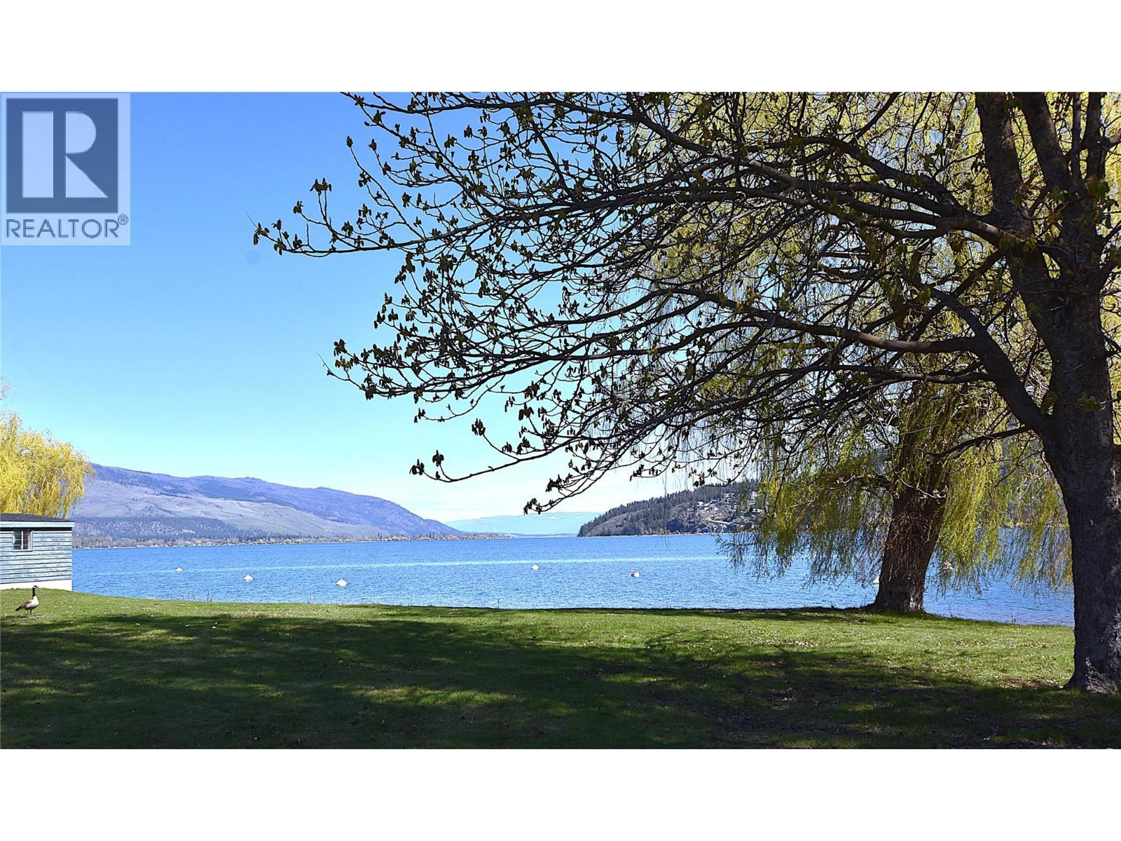 residents share the use of about 2000 ft of prime waterfront - 145 Falcon Avenue, Vernon, BC - Outdoor With Body Of Water With View
