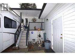 front entry with a chair installed to take you up the stairs -