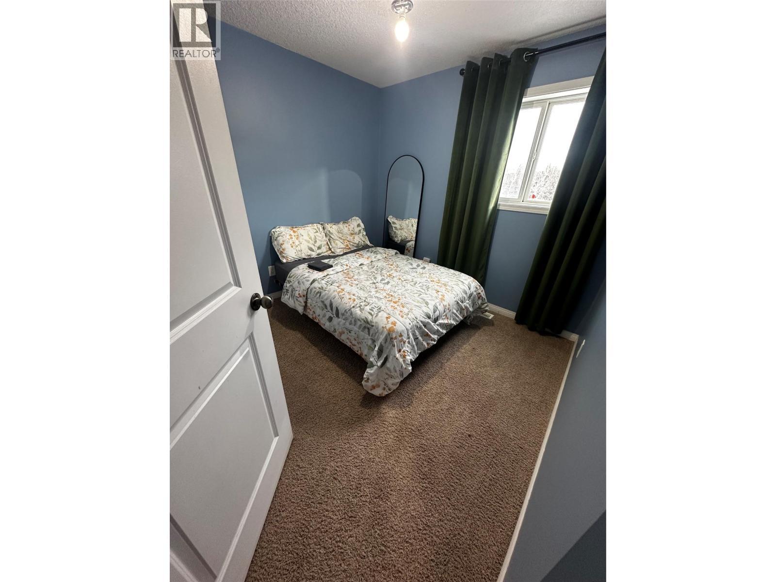 5213 40 St Ne Street, Chetwynd, BC - Indoor Photo Showing Bedroom