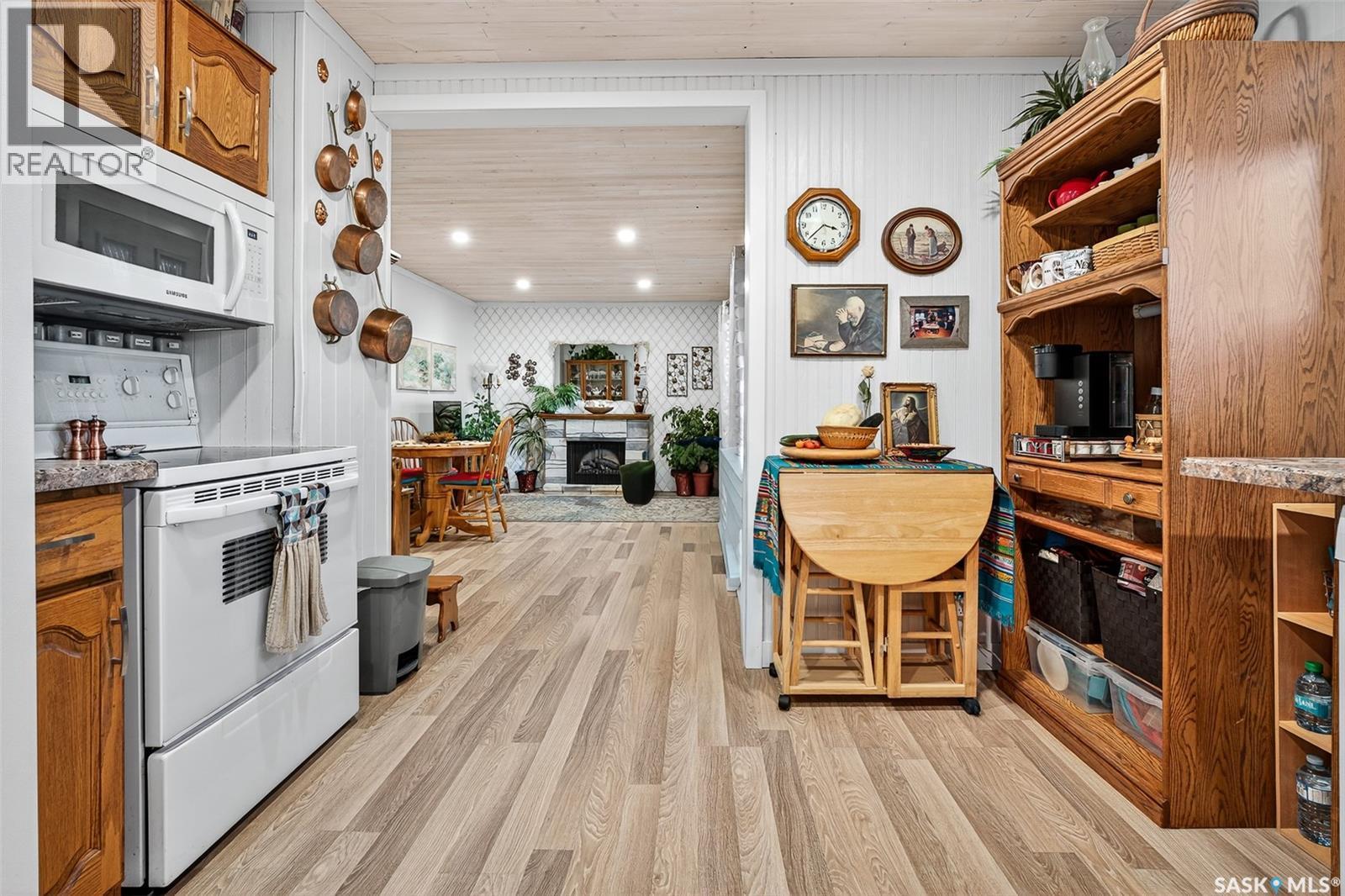 1005 Vaughan Street, Moose Jaw, SK - Indoor Photo Showing Kitchen With Fireplace