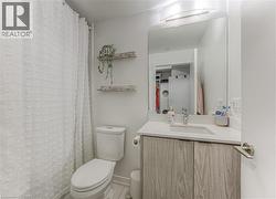 primary bathroom adjacent to a large walk-in closet -
