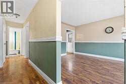 Corridor featuring dark wood-type flooring -