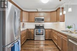 Spacious, upgraded kitchen with granite counters. -