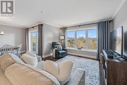 Window wall framing river views & summer breezes! -