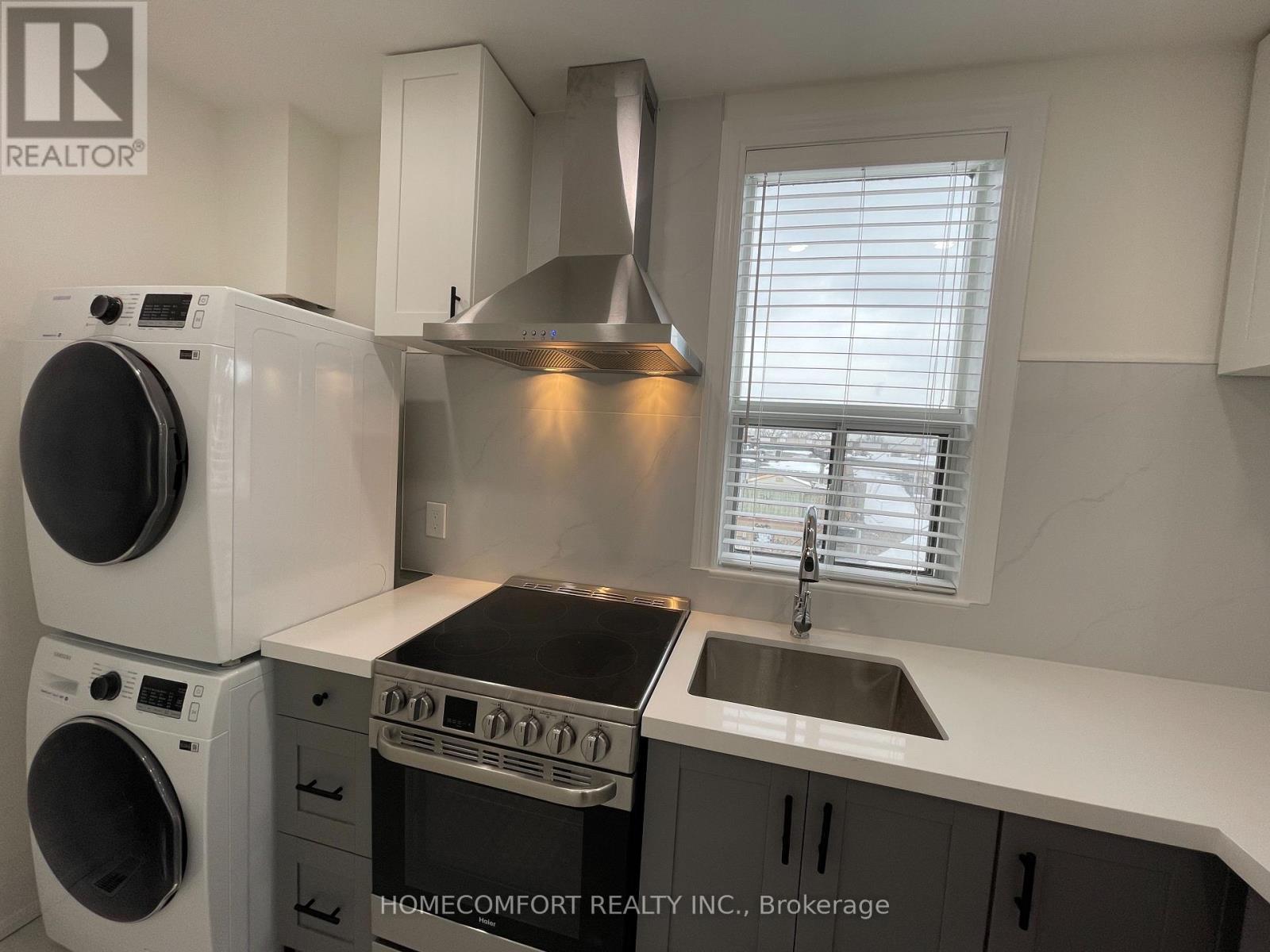 Upper - 33 Strathmore Boulevard, Toronto, ON - Indoor Photo Showing Laundry Room