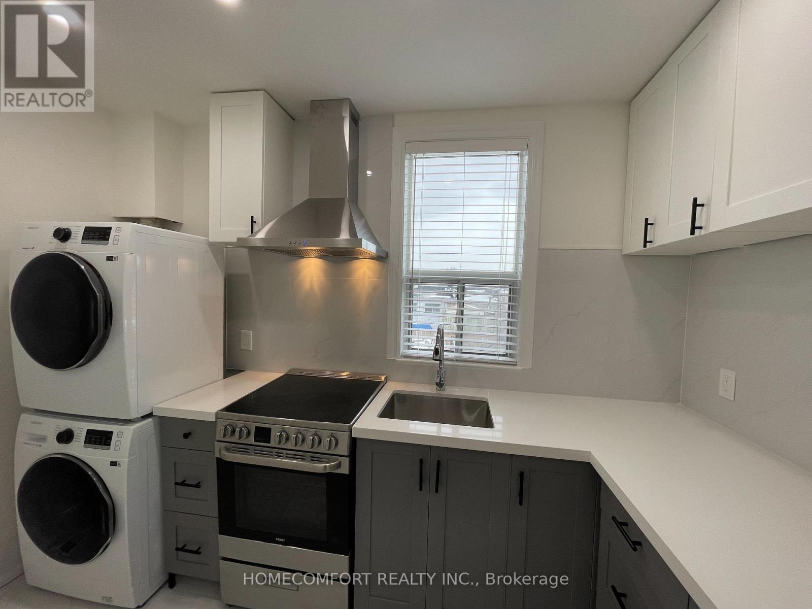 Upper - 33 Strathmore Boulevard, Toronto, ON - Indoor Photo Showing Laundry Room