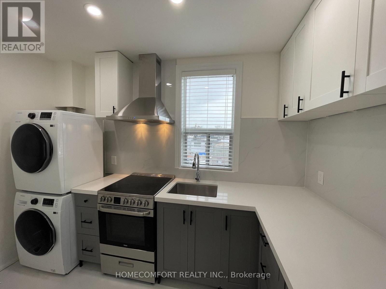 Upper - 33 Strathmore Boulevard, Toronto, ON - Indoor Photo Showing Laundry Room