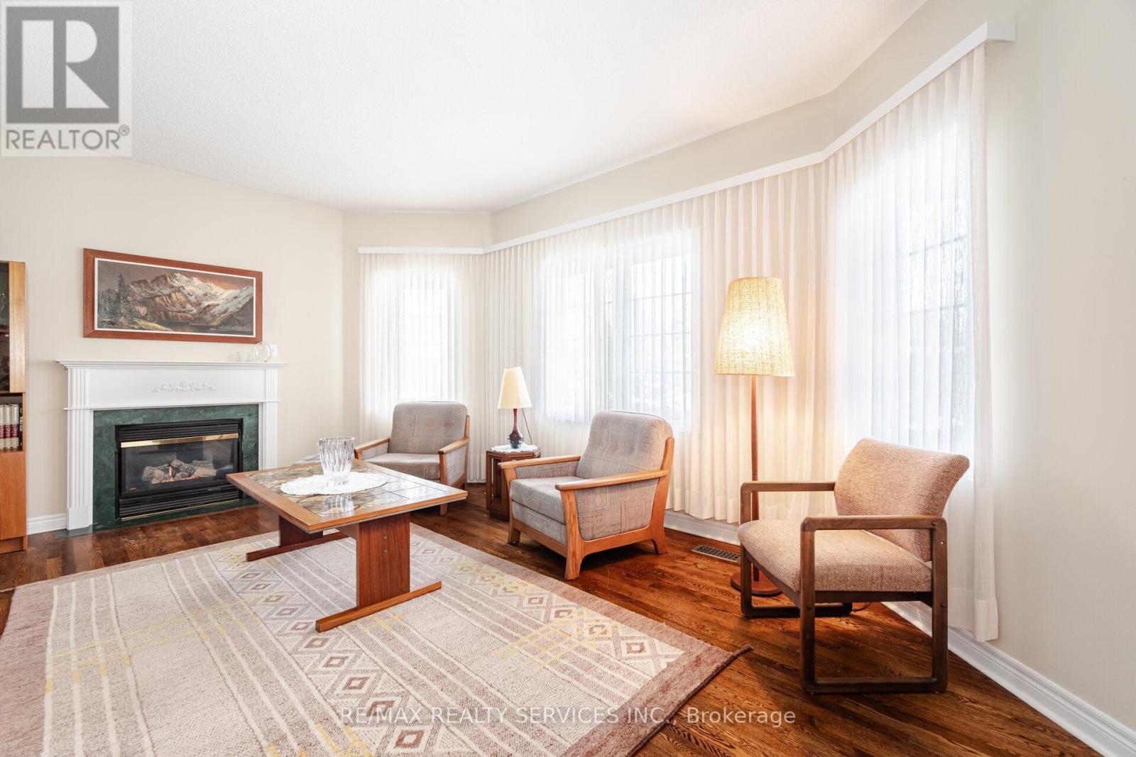 10 Orchard Park Gate, Brampton, ON - Indoor Photo Showing Living Room With Fireplace
