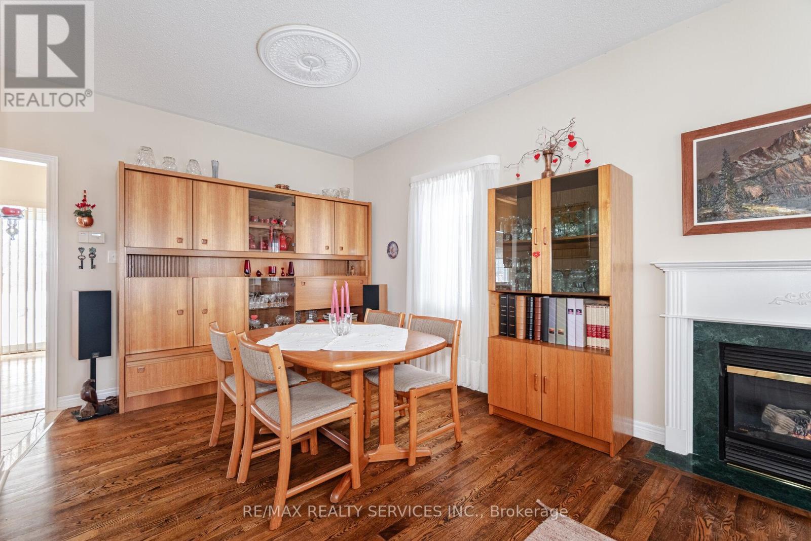 10 Orchard Park Gate, Brampton, ON - Indoor Photo Showing Dining Room With Fireplace
