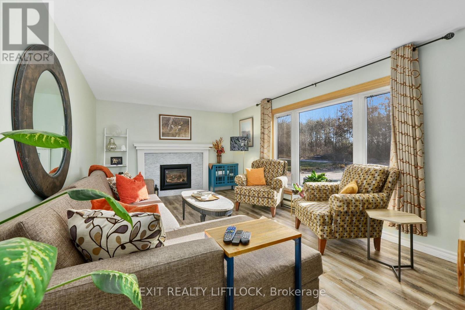2348 18Th Line, Selwyn, ON - Indoor Photo Showing Living Room With Fireplace