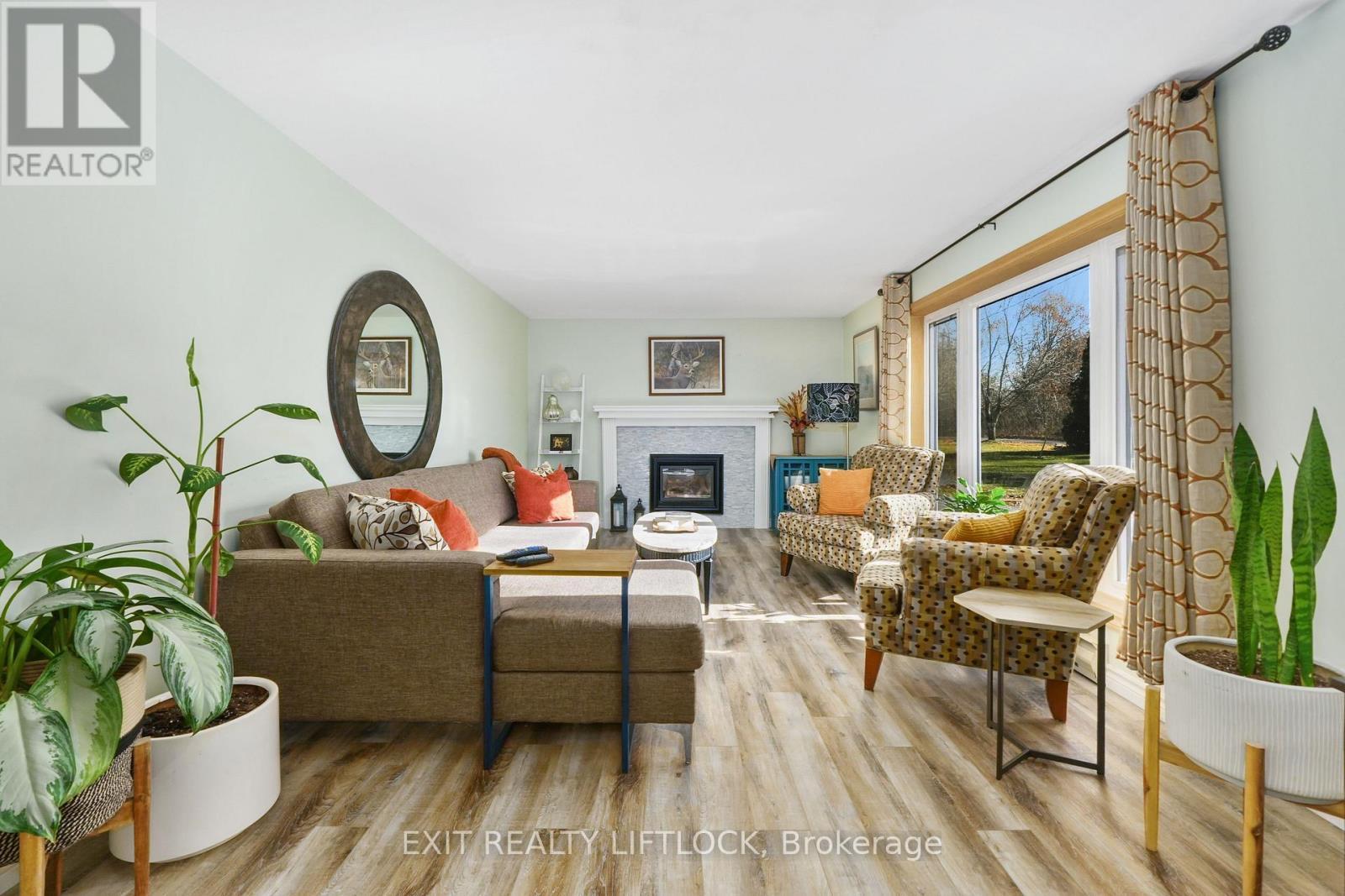 2348 18Th Line, Selwyn, ON - Indoor Photo Showing Living Room With Fireplace