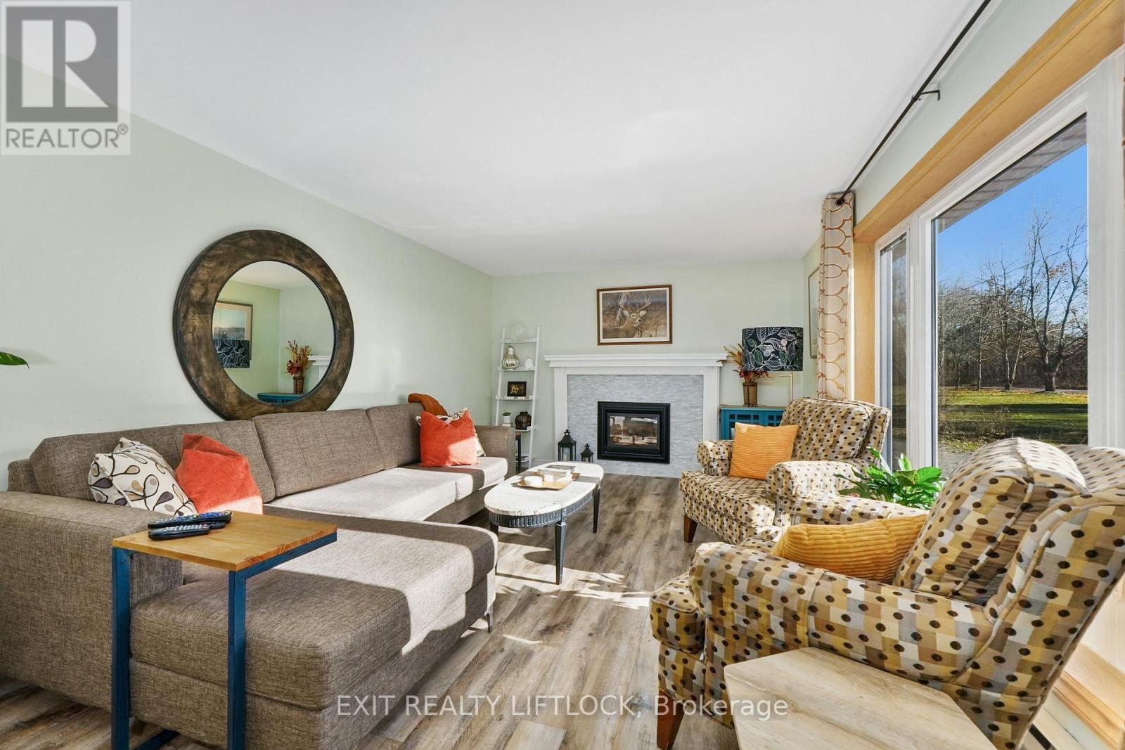2348 18Th Line, Selwyn, ON - Indoor Photo Showing Living Room With Fireplace