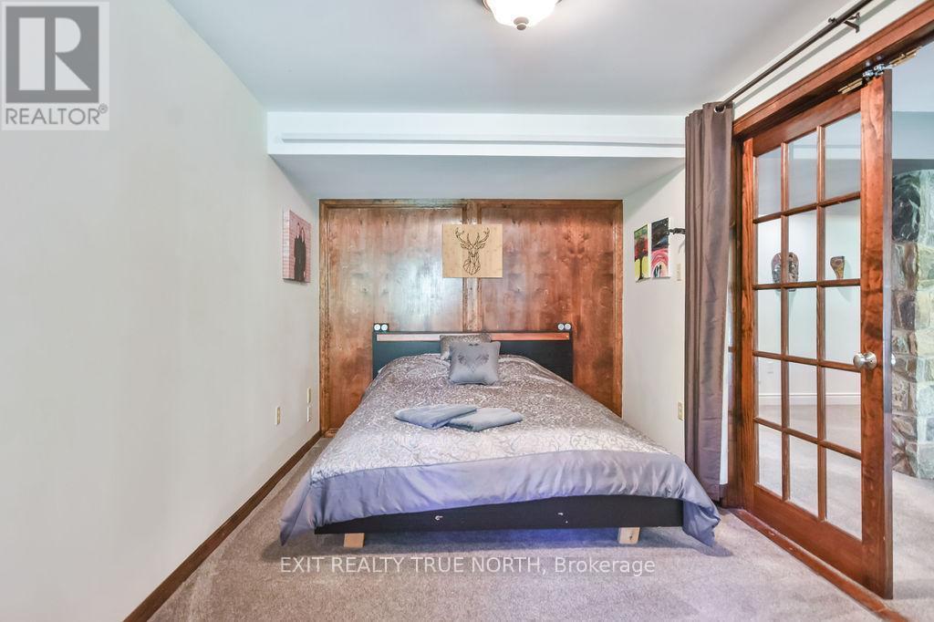 Versatile room with double french doorss - 28 Nicholson Crescent, Springwater, ON - Indoor Photo Showing Bedroom