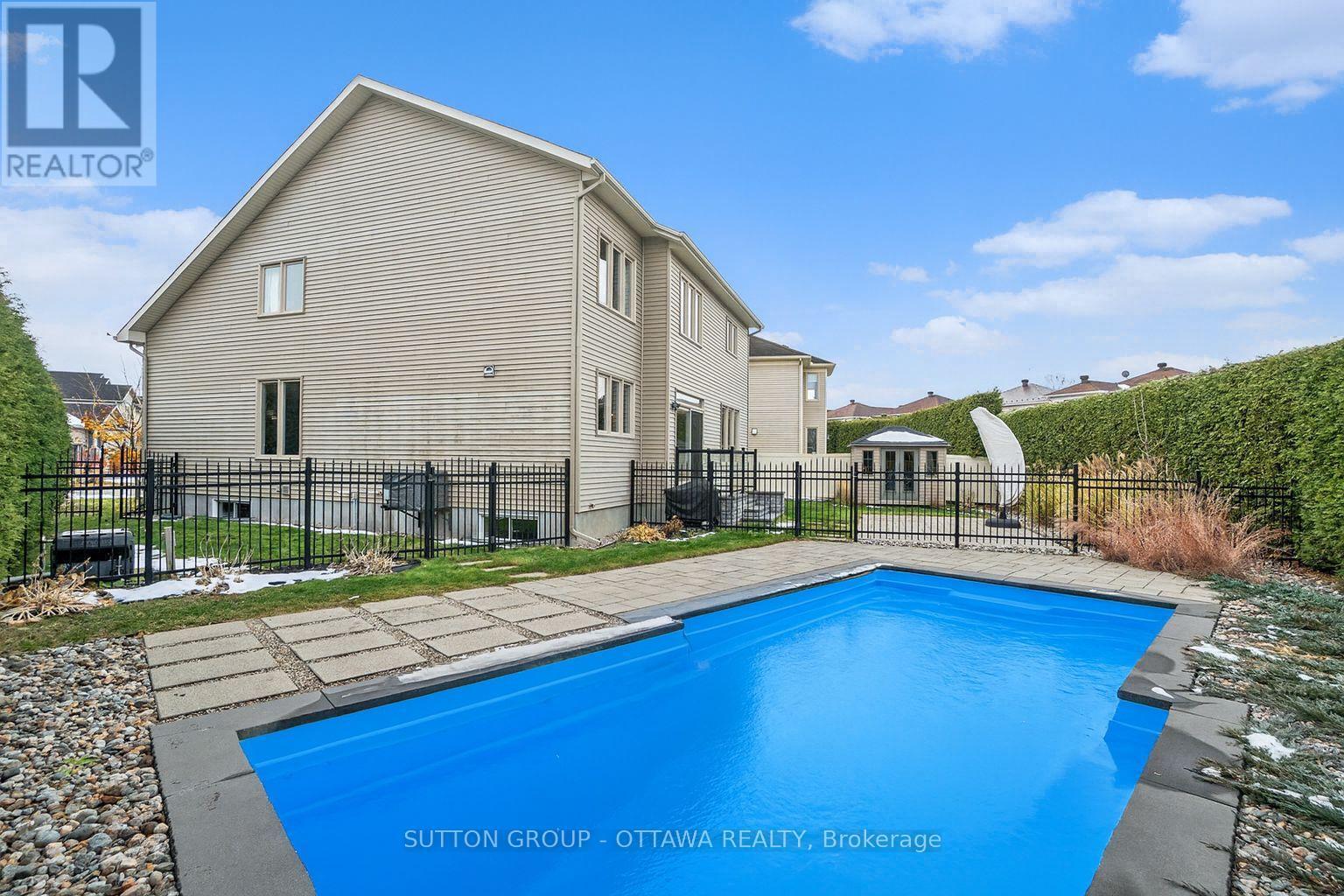 Fully landscaped yard with in-ground pool - 1969 Plainhill Drive, Ottawa, ON - Outdoor With In Ground Pool