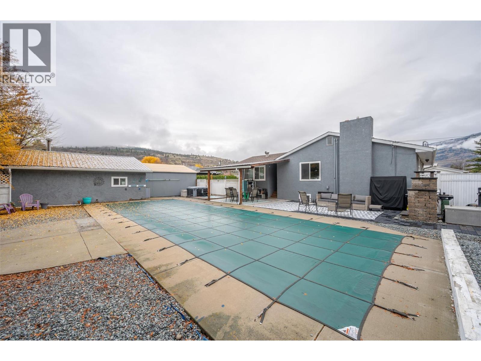 backyard - 225 Circle Drive, Oliver, BC - Outdoor With In Ground Pool