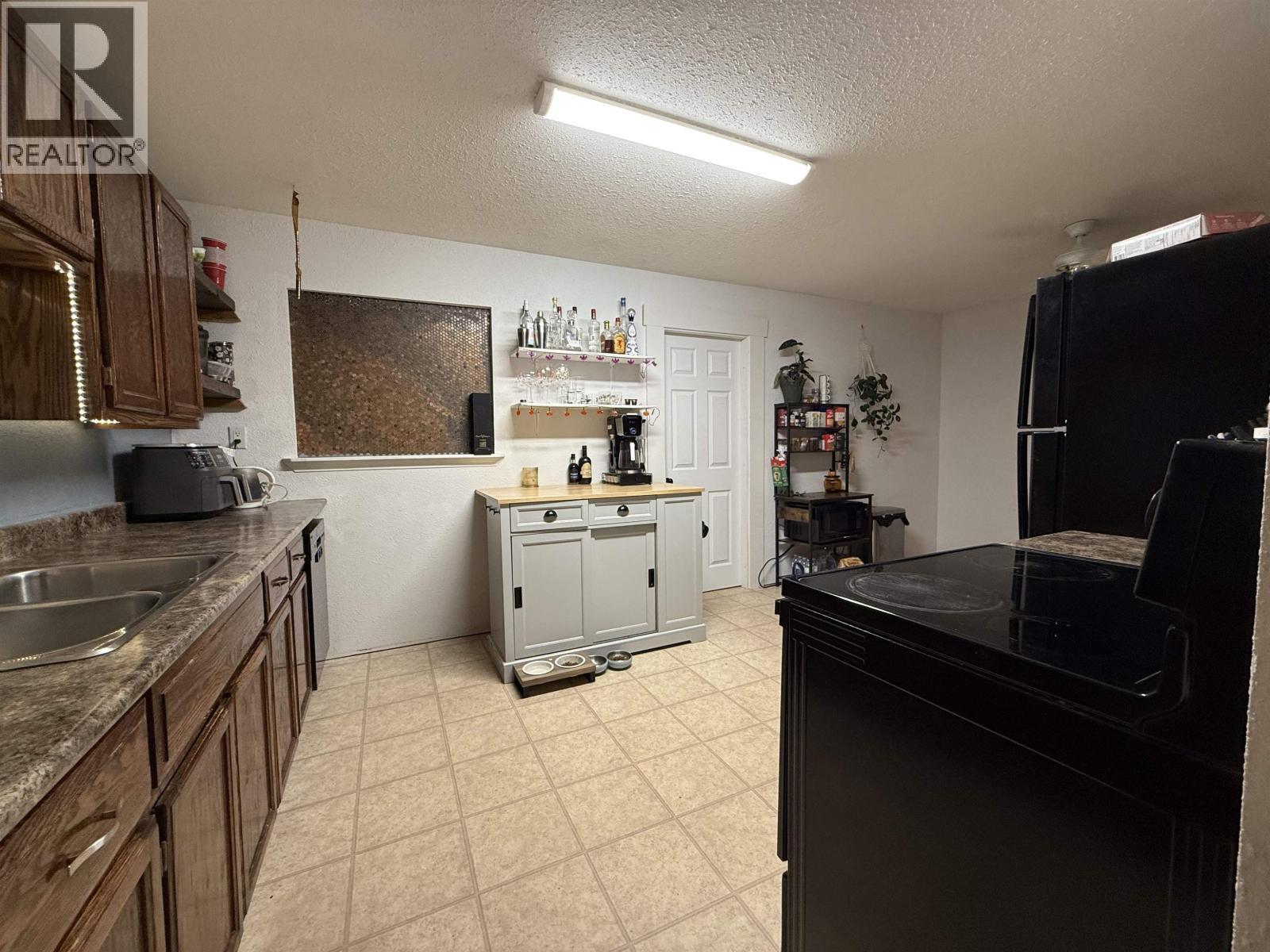 15 Omenica Street, Kitimat, BC - Indoor Photo Showing Kitchen With Double Sink