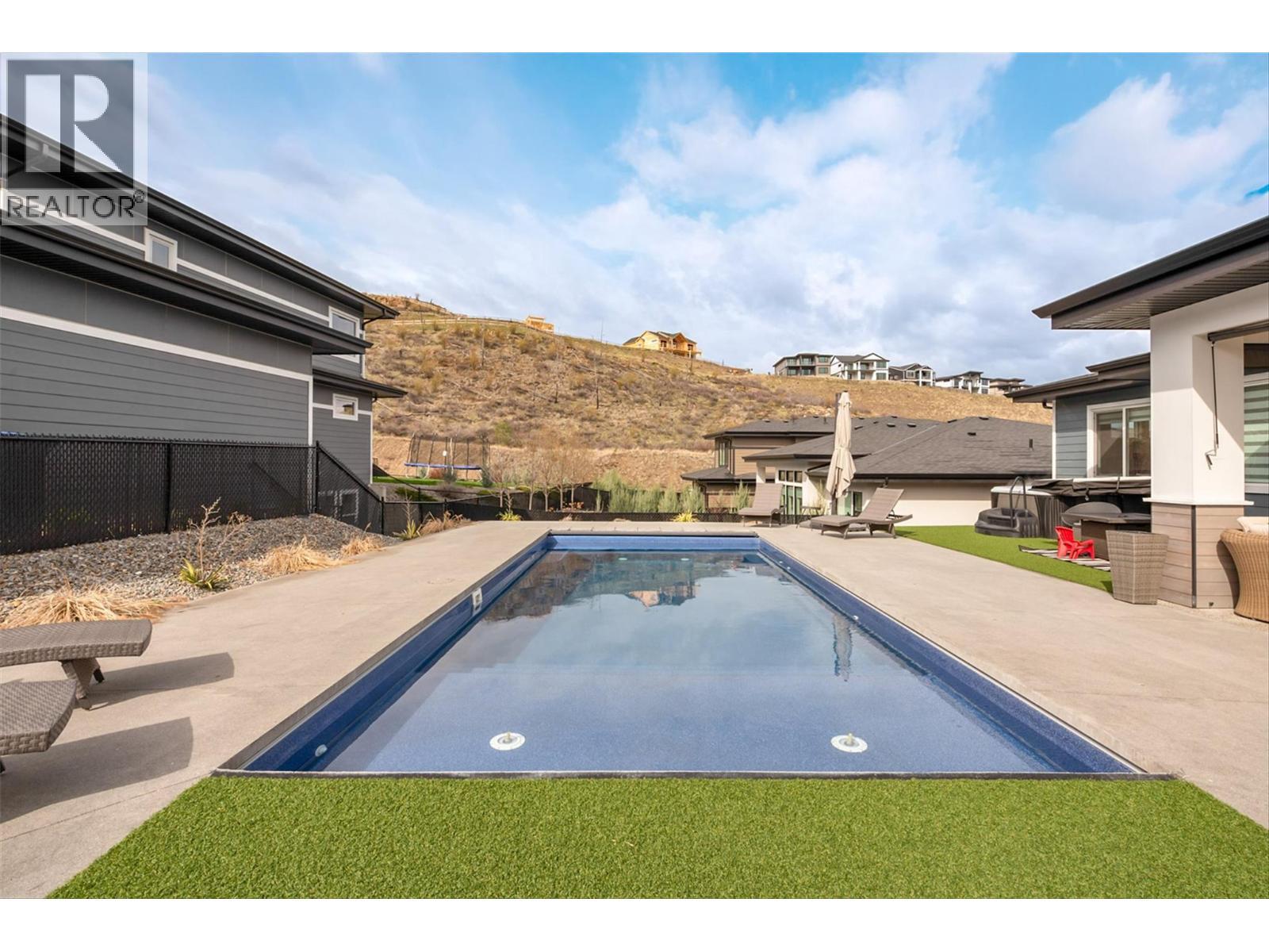 Salt Water Pool with push button retractable cover - 1235 Ponds Avenue, Kelowna, BC - Outdoor With In Ground Pool