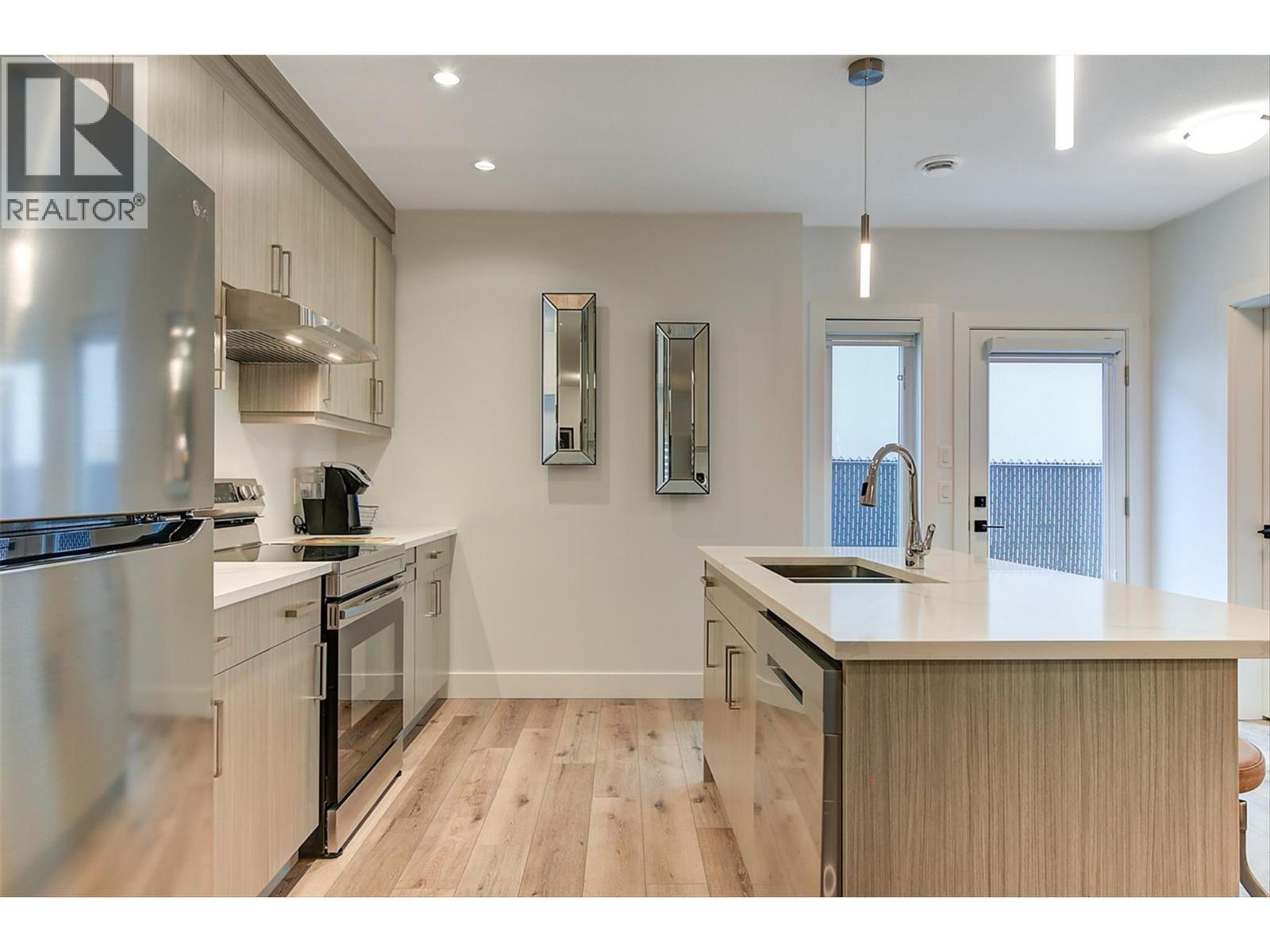 SUITE - Separate Entrance with Remote Control Blinds - 1235 Ponds Avenue, Kelowna, BC - Indoor Photo Showing Kitchen With Double Sink With Upgraded Kitchen