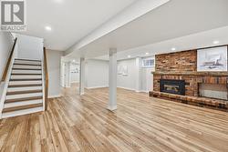 Large Recreation Room with a Brick Gas Fireplace -