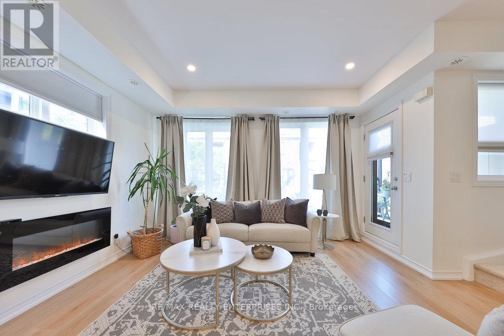 71 - 130 Twenty Fourth Street, Toronto, ON - Indoor Photo Showing Living Room With Fireplace
