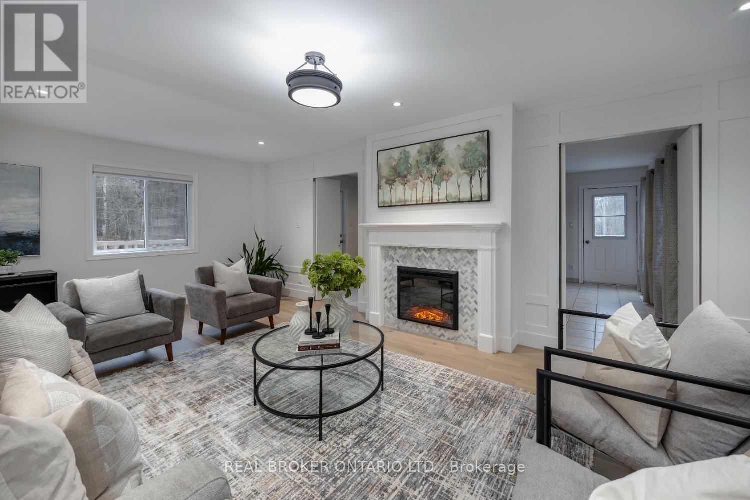 398 Sandy Hook Road, Kawartha Lakes (Manvers), ON - Indoor Photo Showing Living Room With Fireplace