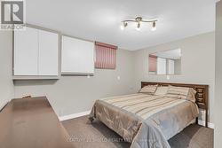 space set up as bedroom, used to be in-law kitchen -