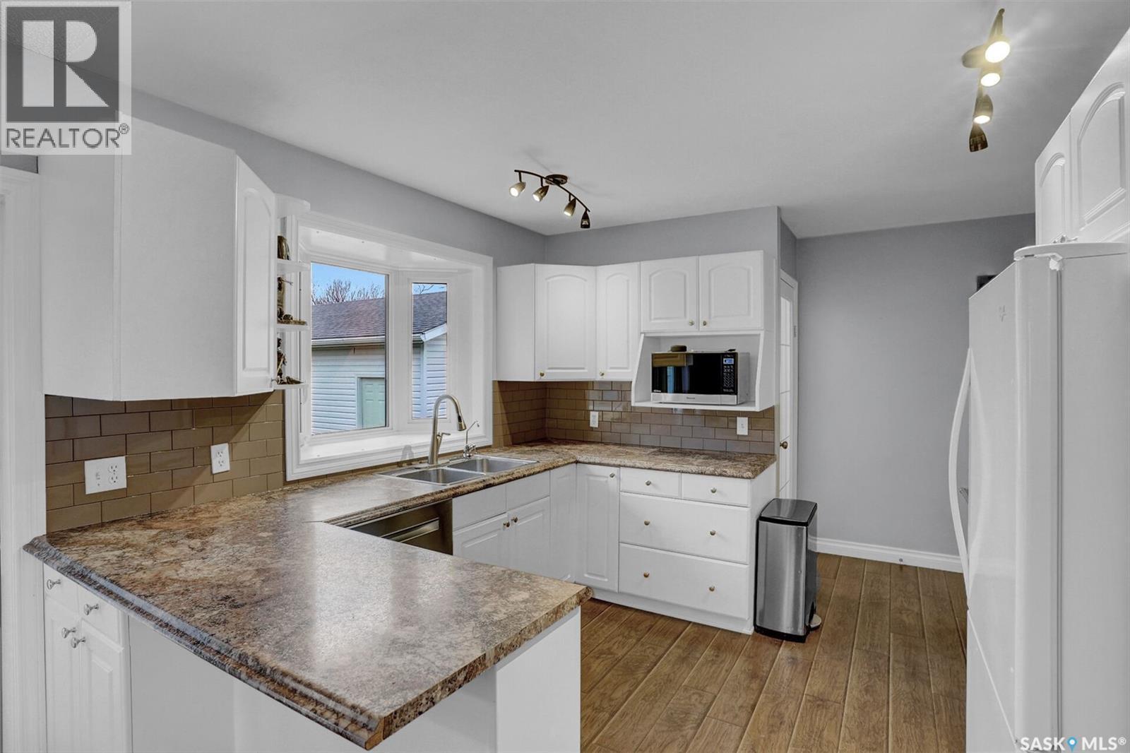 25 Haultain Crescent, Regina, SK - Indoor Photo Showing Kitchen With Double Sink