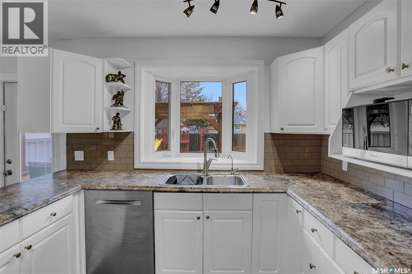 25 Haultain Crescent, Regina, SK - Indoor Photo Showing Kitchen With Double Sink