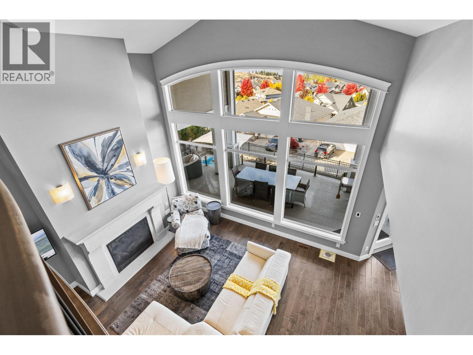 388 Rindle Court, Kelowna, BC - Indoor Photo Showing Other Room With Fireplace