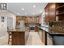 Lovely kitchen with granite counters, and stainless appliances -