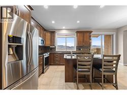 Lovely kitchen with granite counters, and stainless appliances -