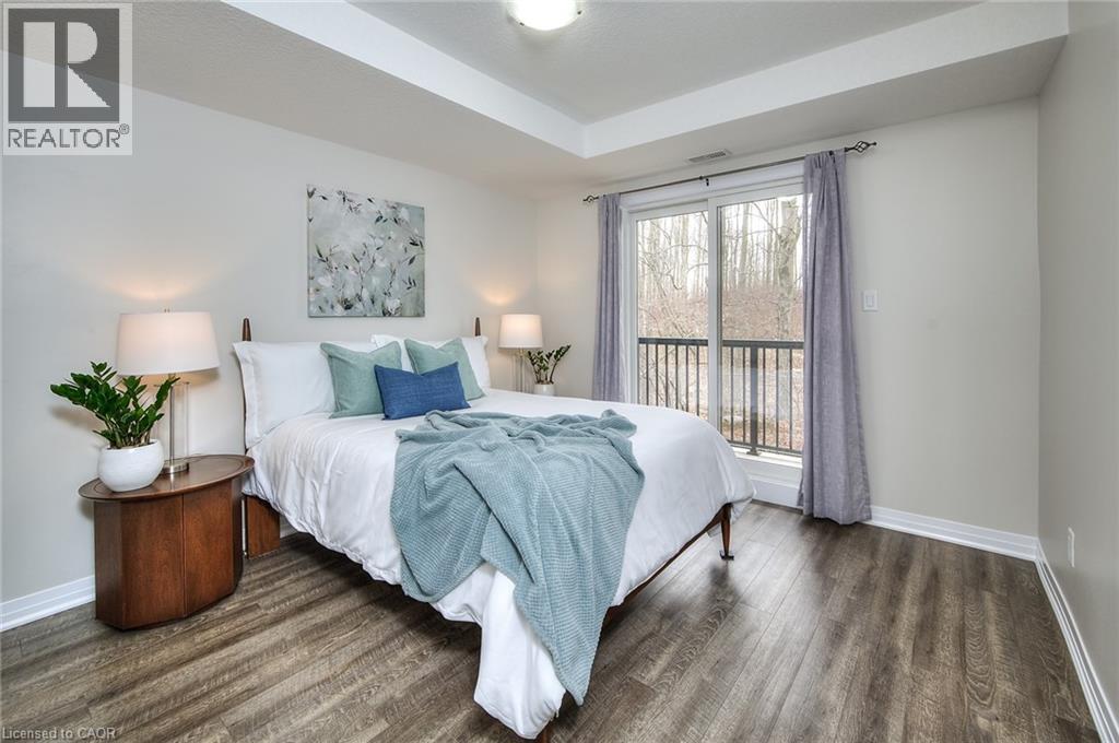 Walkout from the primary bedroom - 1989 Ottawa Street S Unit# 30F, Kitchener, ON - Indoor Photo Showing Bedroom