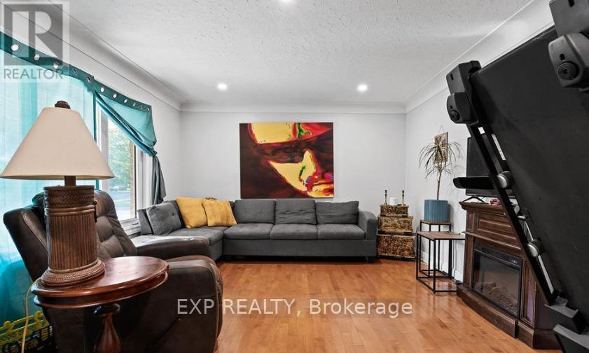 Upper - 304 First Avenue, Welland, ON - Indoor Photo Showing Living Room With Fireplace