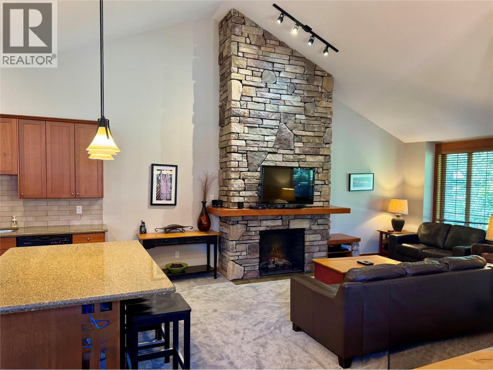 47 Rivermount Place Unit# 101B, Fernie, BC - Indoor Photo Showing Living Room With Fireplace