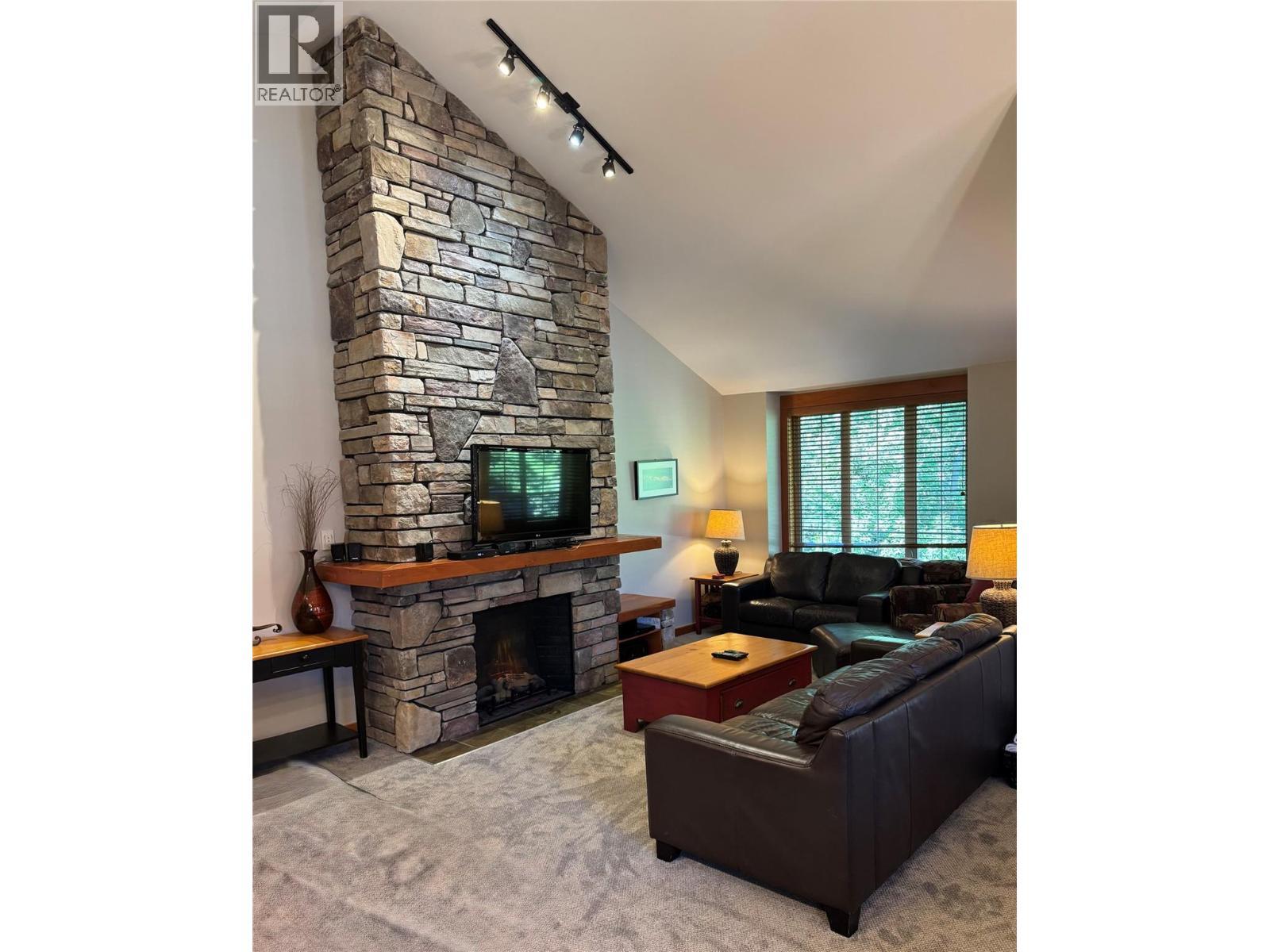 47 Rivermount Place Unit# 101B, Fernie, BC - Indoor Photo Showing Living Room With Fireplace