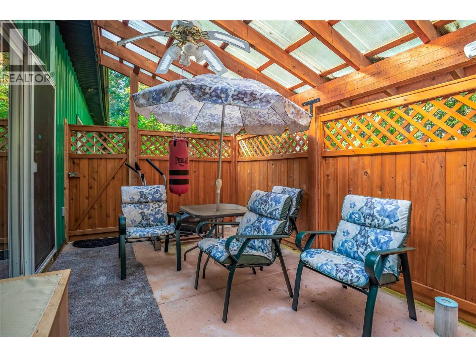 Patio off primary Bedroom - 60 Pringle Road, Carmi, BC - Outdoor With Deck Patio Veranda