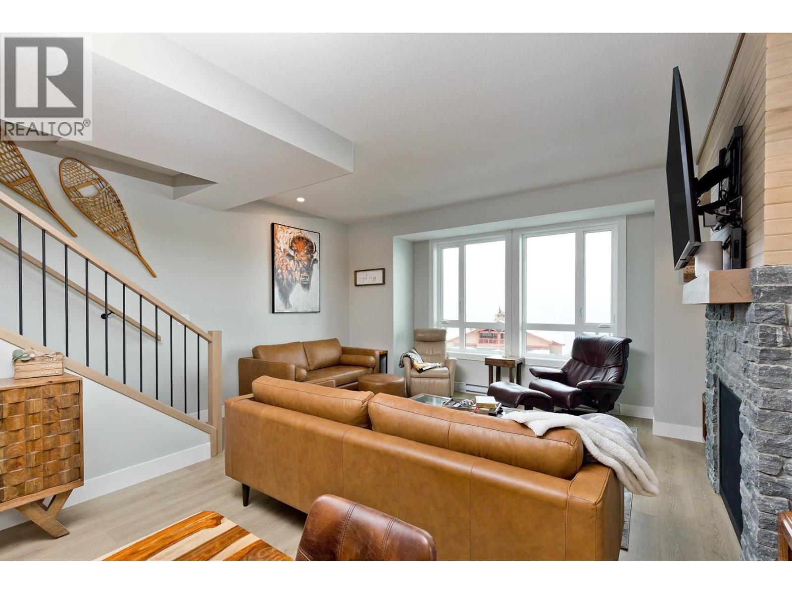 120 Grizzly Ridge Trail Unit# 12, Big White, BC - Indoor Photo Showing Living Room With Fireplace