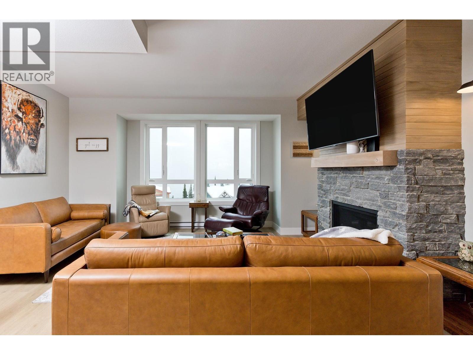 120 Grizzly Ridge Trail Unit# 12, Big White, BC - Indoor Photo Showing Living Room With Fireplace