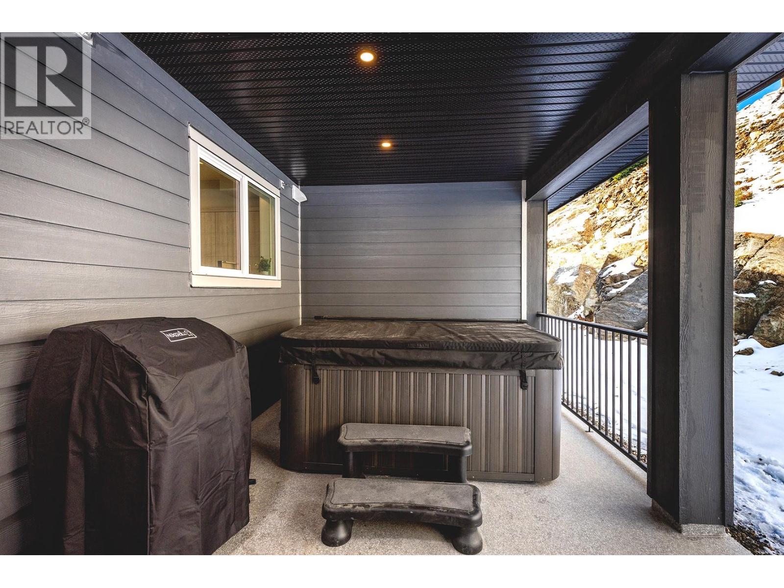 Extra Large Deck with Hot tub - 120 Grizzly Ridge Trail Unit# 12, Big White, BC - Outdoor With Exterior