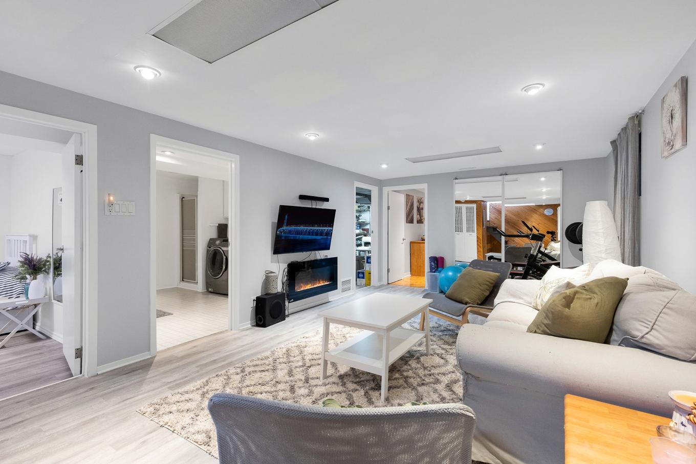 Sous-sol - 380 Rue Joly, Laval (Duvernay), QC - Indoor Photo Showing Living Room With Fireplace