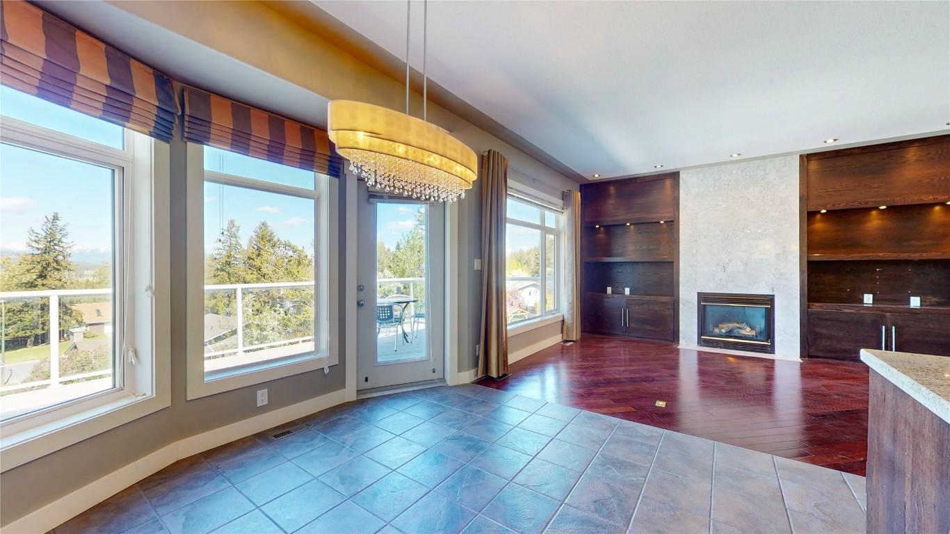 1631 Mt. Pyramid Crescent, Cranbrook, BC - Indoor Photo Showing Other Room With Fireplace