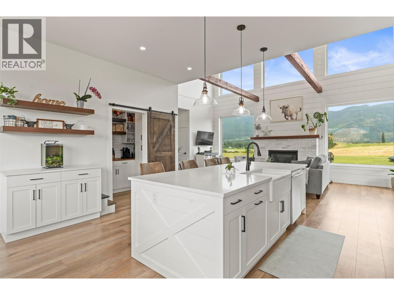 2589 Young Road, Spallumcheen, BC - Indoor Photo Showing Kitchen With Fireplace