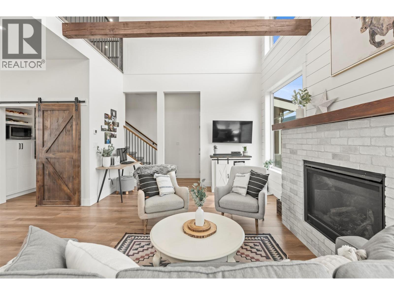 2589 Young Road, Spallumcheen, BC - Indoor Photo Showing Living Room With Fireplace