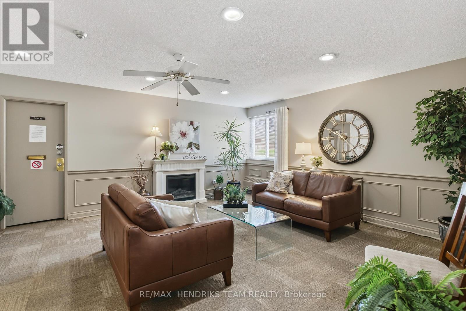 417 - 196 Scott Street, St. Catharines (Fairview), ON - Indoor Photo Showing Living Room With Fireplace